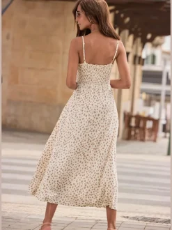 Robe mi-longue à pois avec bretelles spaghetti ajustables