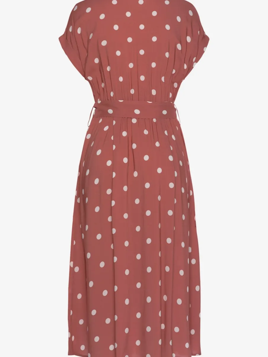 Robe mi-longue à pois avec ceinture et poches latérales