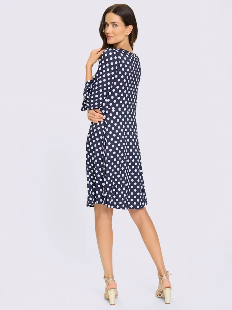 Robe à pois avec col rond et manches évasées