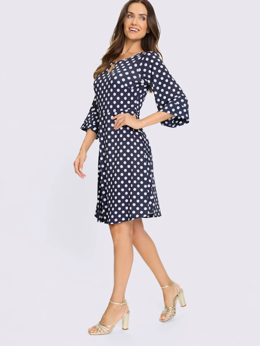 Robe à pois avec col rond et manches évasées