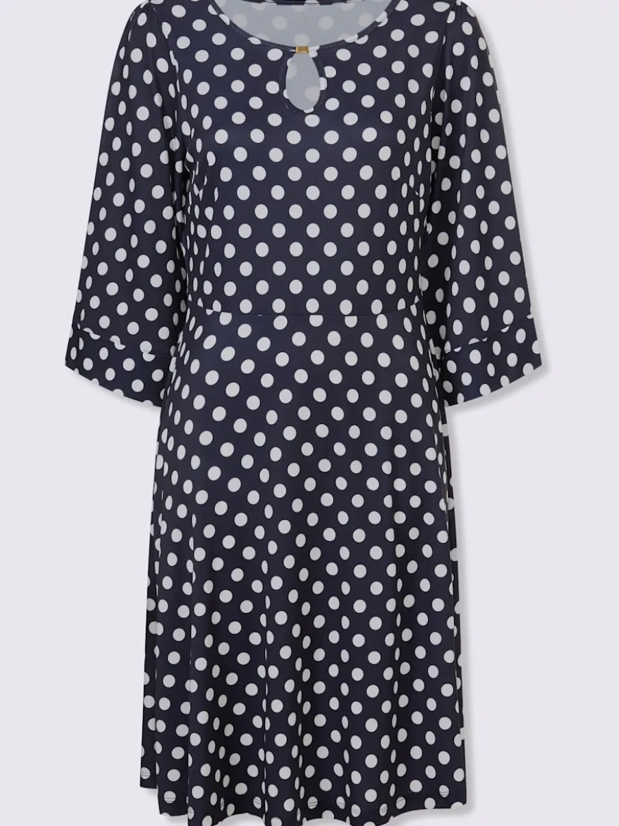 Robe à pois avec col rond et manches évasées