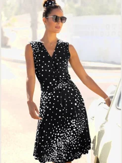Robe portefeuille à pois avec ceinture et manches sans manches