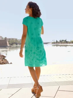 Robe tissée à encolure U avec broderie florale et poches latérales