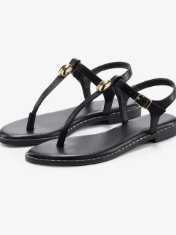 Sandales élégantes avec rivets dorés