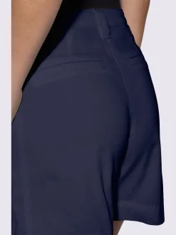Short en coton extensible à taille légèrement haute avec poches décoratives et jambes larges