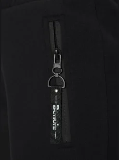 Short en matière sweat avec poches latérales zippées et ceinture élastique
