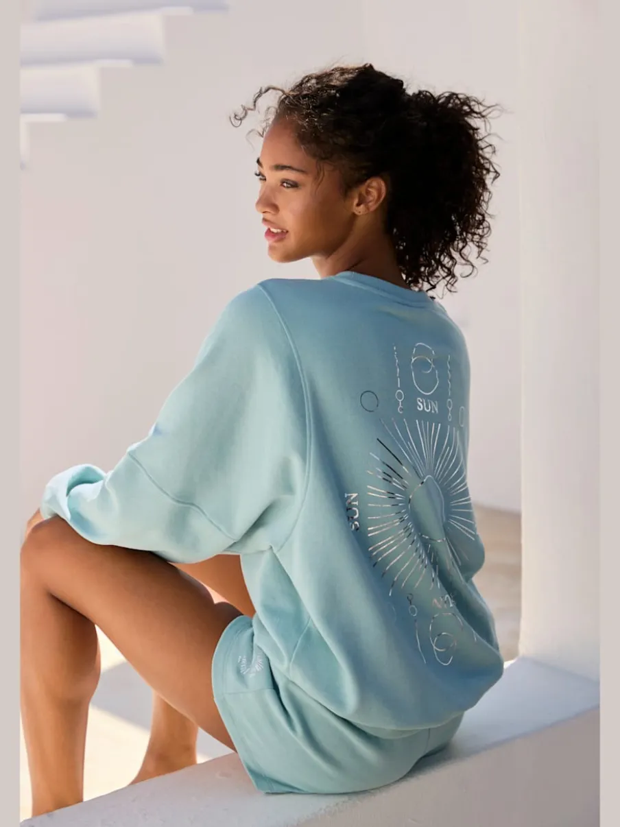 Short en matière sweat avec ruban à coulisse et poches fendues