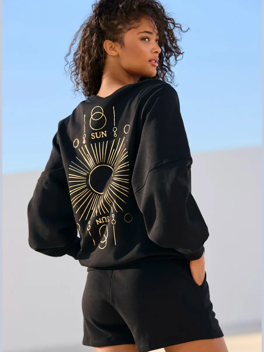Short en matière sweat avec ruban à coulisse et poches fendues