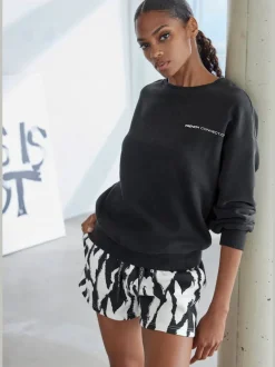 Short molletonné ample à imprimé doux avec poches pratiques