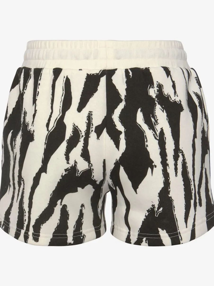 Short molletonné ample à imprimé doux avec poches pratiques