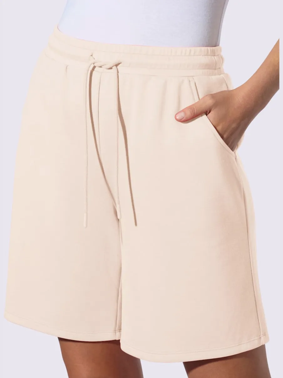 Short sweat à ceinture élastique avec poches et lien à nouer