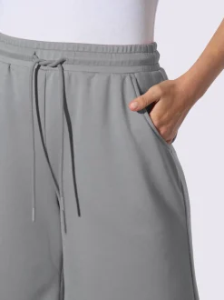Short sweat à ceinture élastique avec poches et lien à nouer