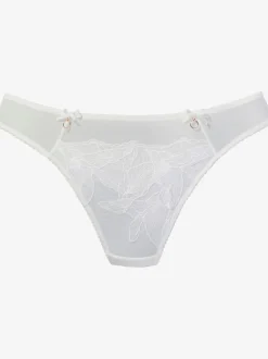 String extravagant avec nœuds décoratifs et accessoires devant sur le côté