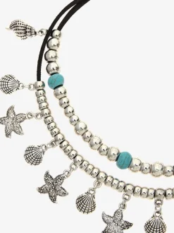 Superbe chaîne de cheville avec pendentifs