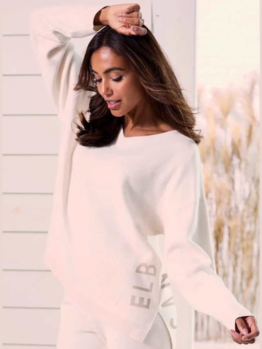 Sweater ample avec encolure en V et manches longues.