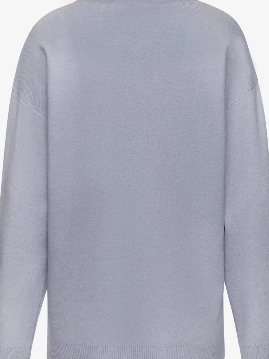 Sweater ample avec encolure en V et manches longues.