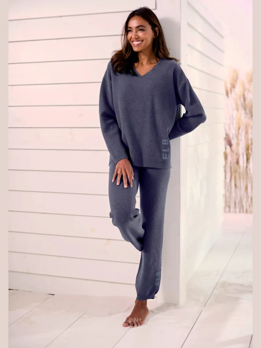 Sweater ample avec encolure en V et manches longues.
