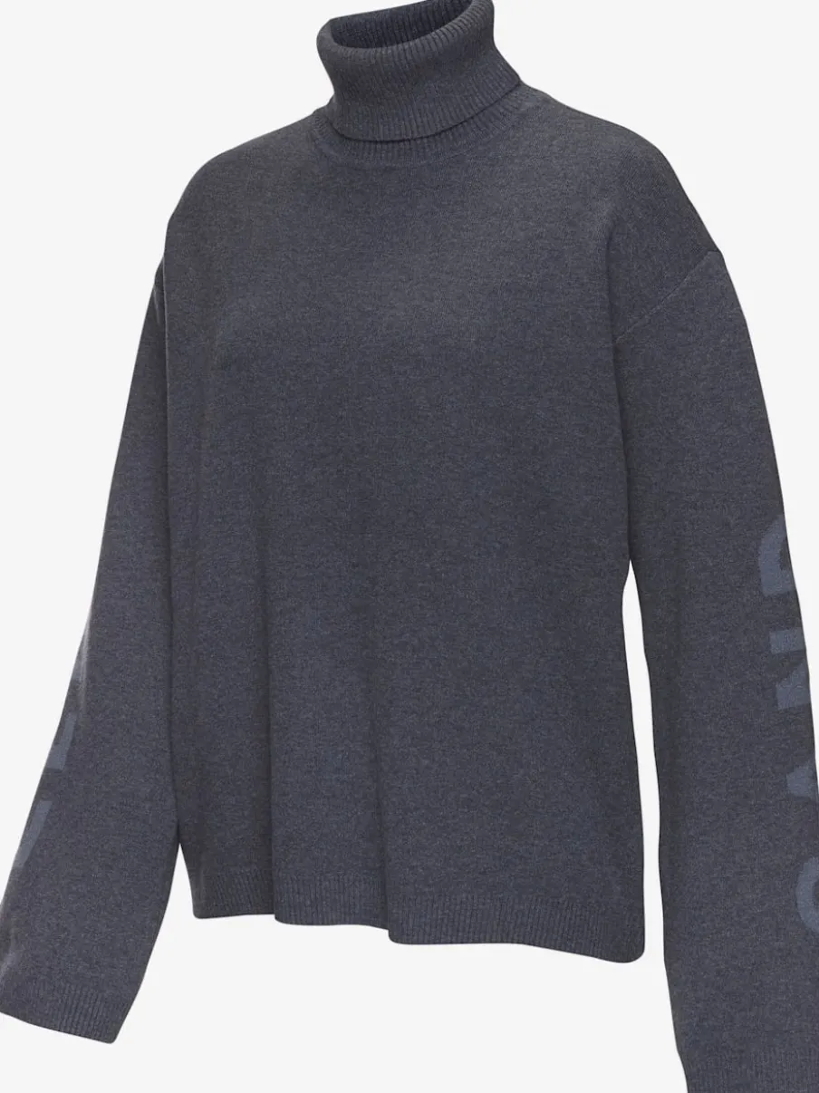 Sweater en tricot doux avec col roulé et manches longues