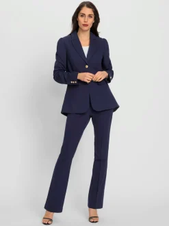 Tailleurs pantalons avec col à revers et manches bouffantes