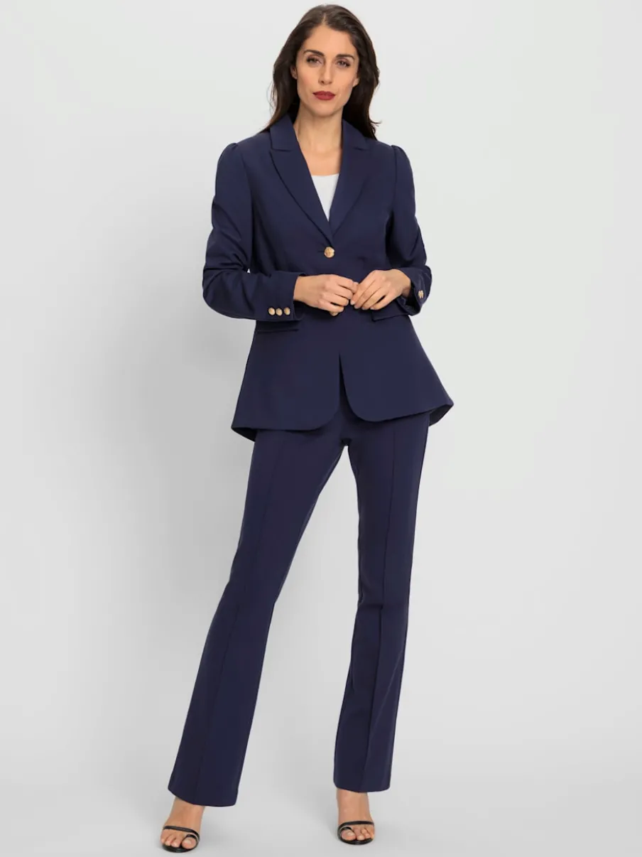 Tailleurs pantalons avec col à revers et manches bouffantes