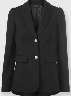 Tailleurs pantalons avec col à revers et manches bouffantes