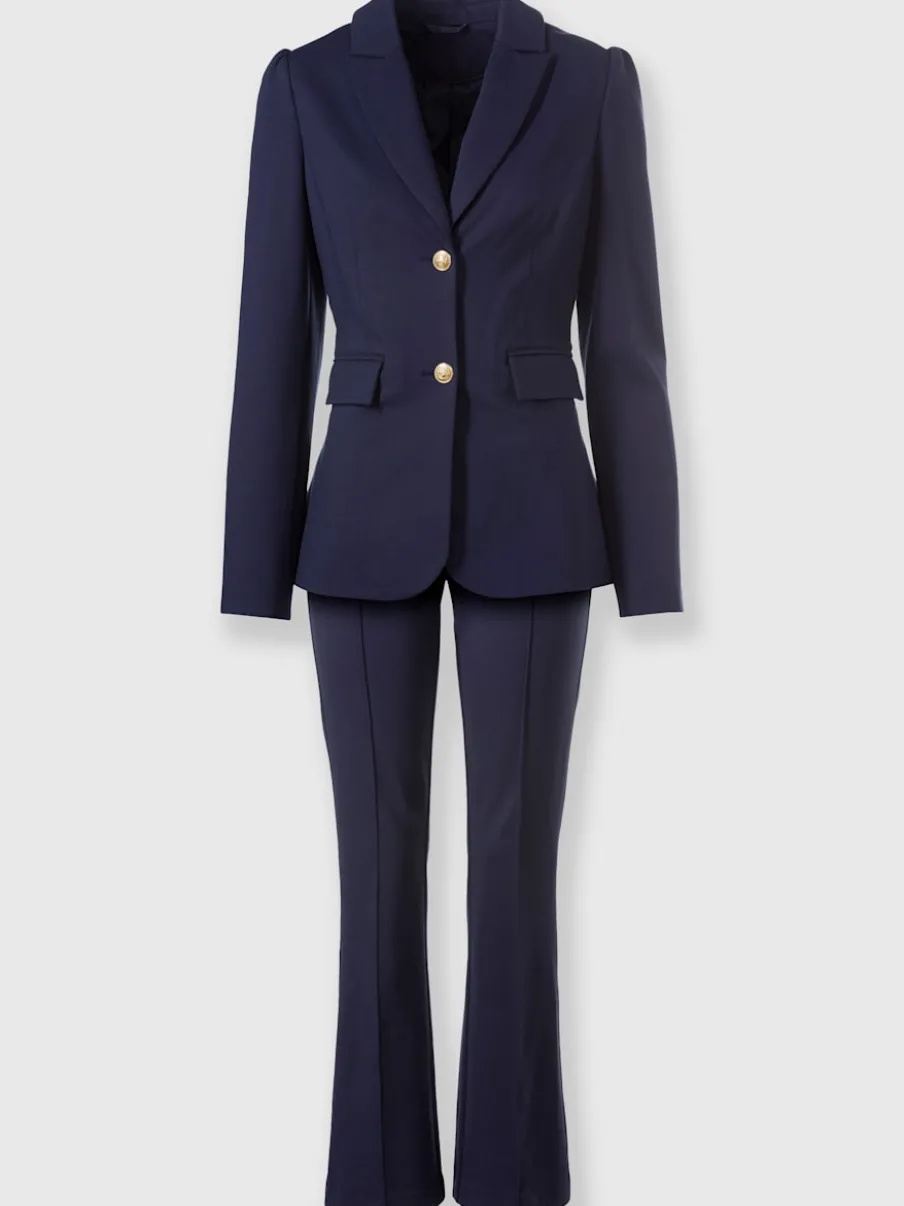 Tailleurs pantalons avec col à revers et manches bouffantes