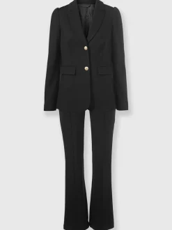 Tailleurs pantalons avec col à revers et manches bouffantes