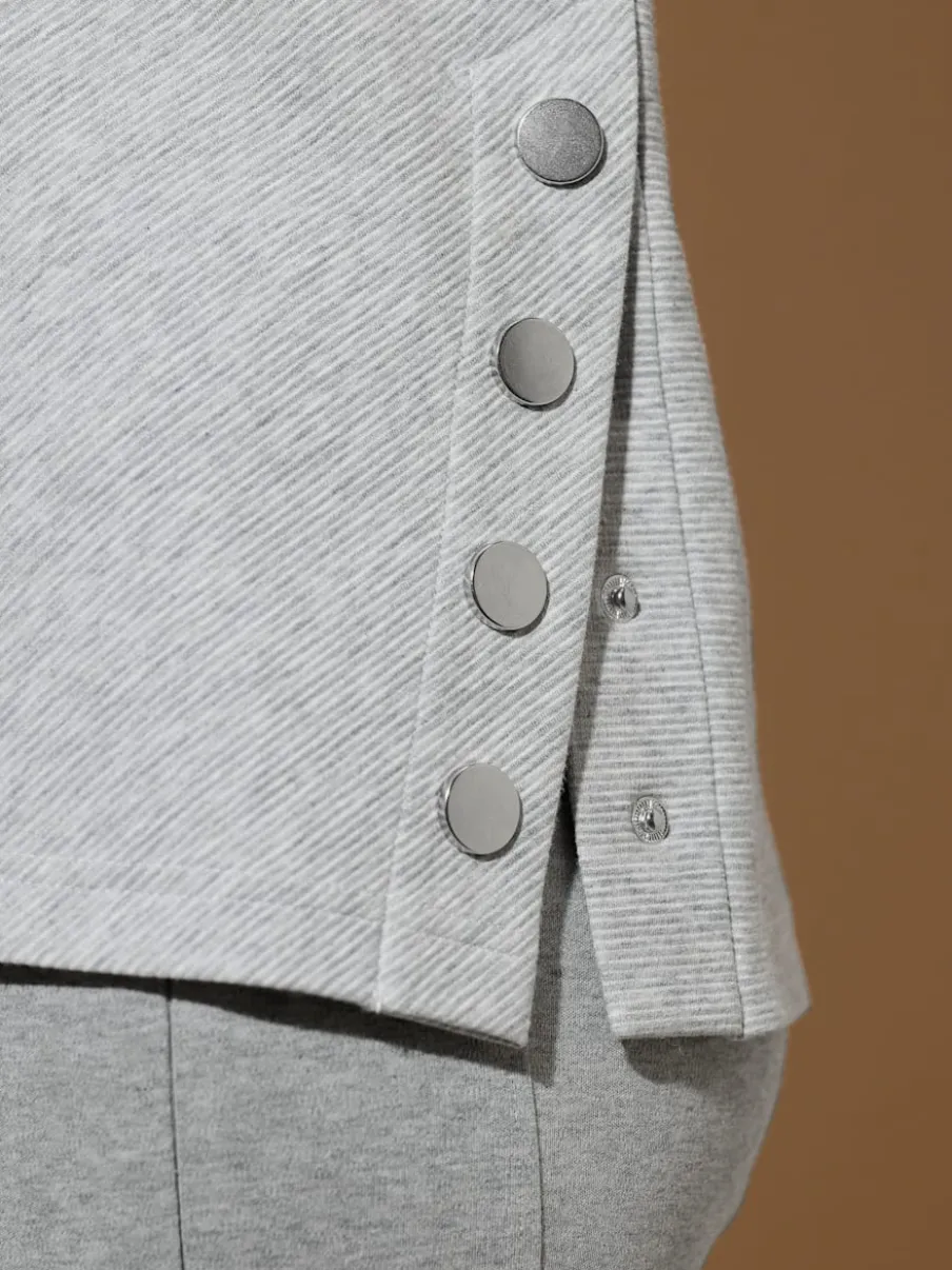 Tenue détente à col montant avec manches longues et détails brodés
