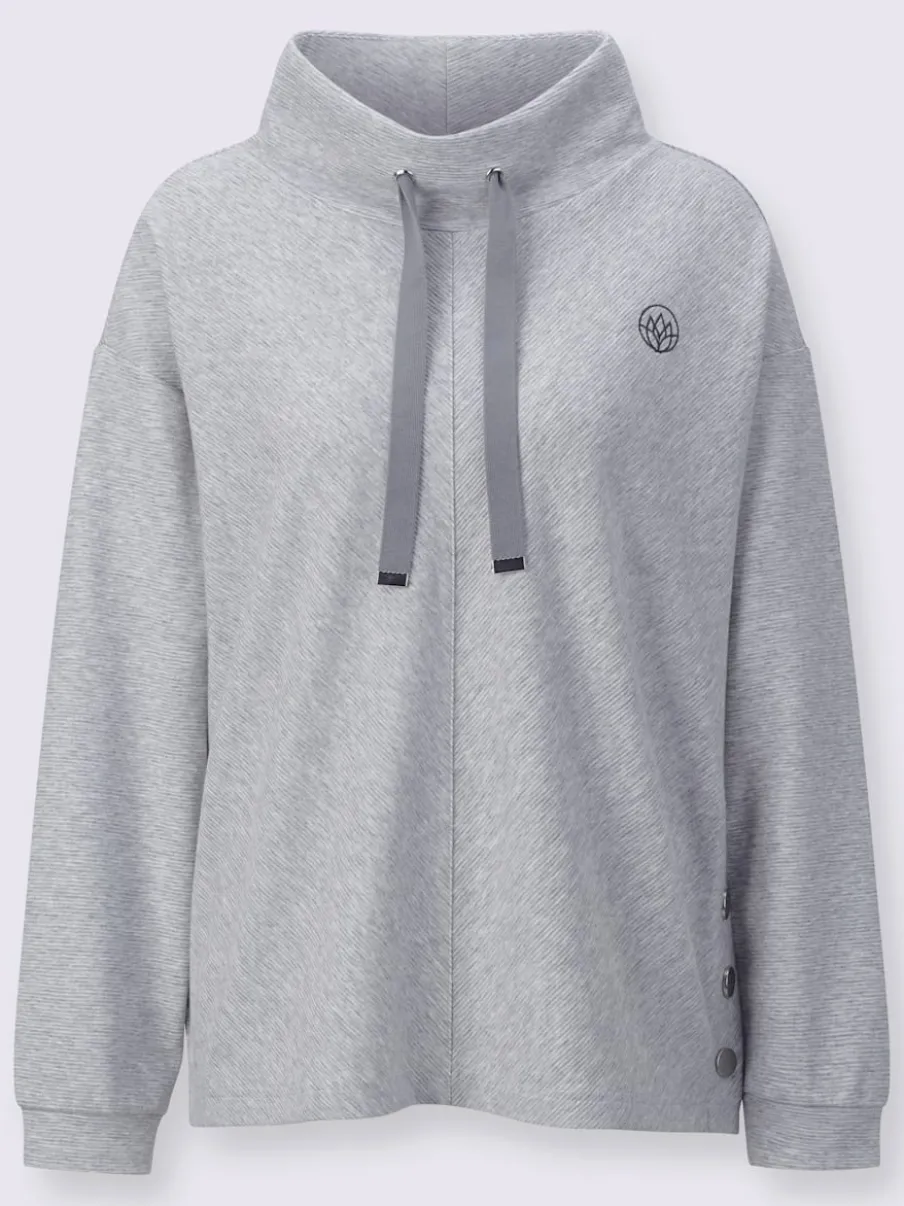 Tenue détente à col montant avec manches longues et détails brodés