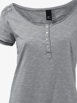 T-shirt à col rond avec détails dentelle et boutons brillants