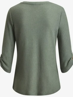 T-shirt à col rond avec manches 3/4 et boutons à l'ourlet