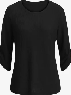 T-shirt à col rond avec manches 3/4 et boutons à l'ourlet