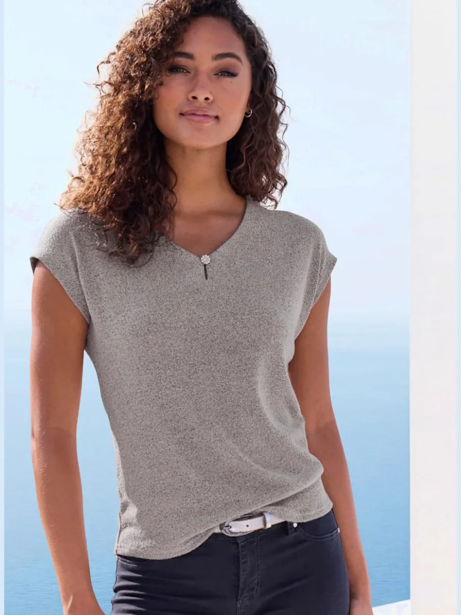 T-shirt à encolure V avec bouton brillant et strass