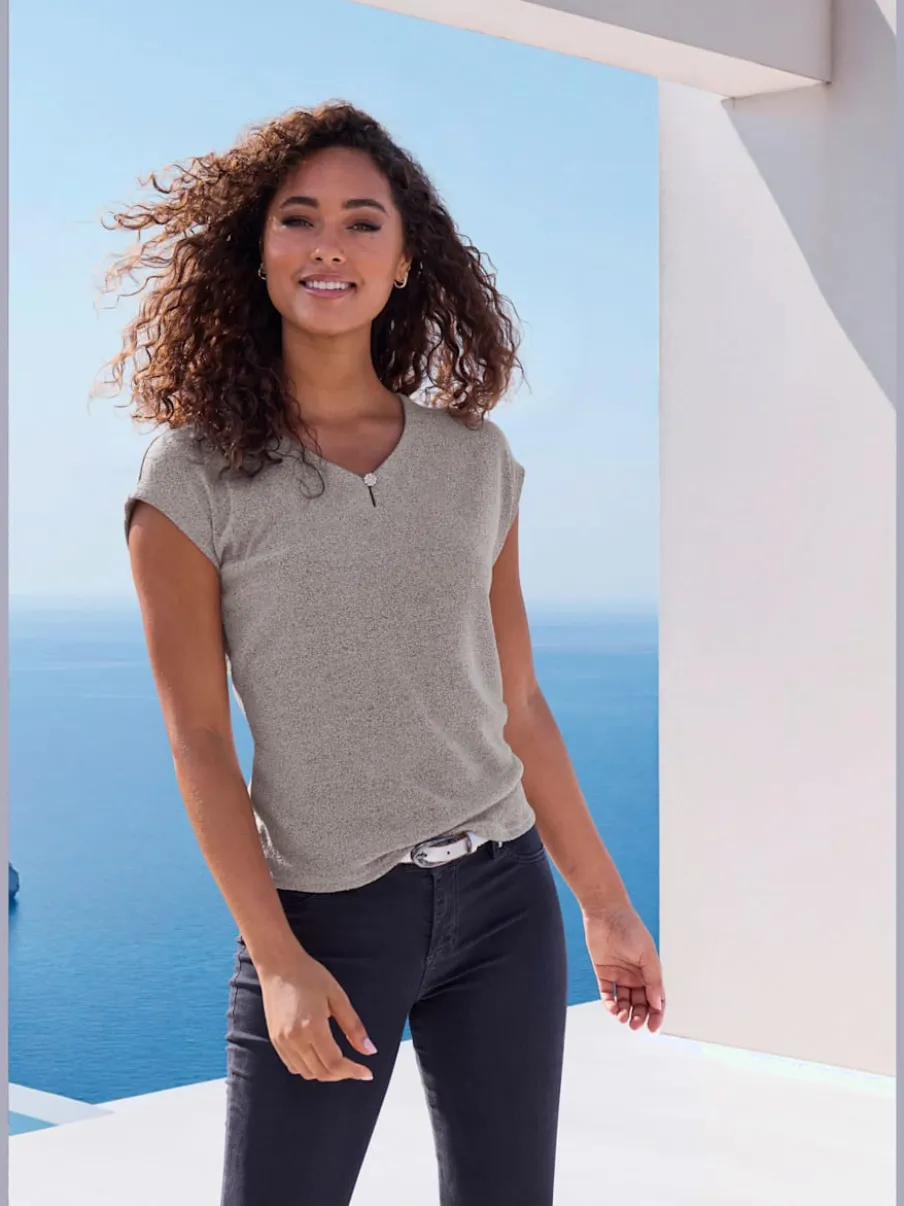 T-shirt à encolure V avec bouton brillant et strass