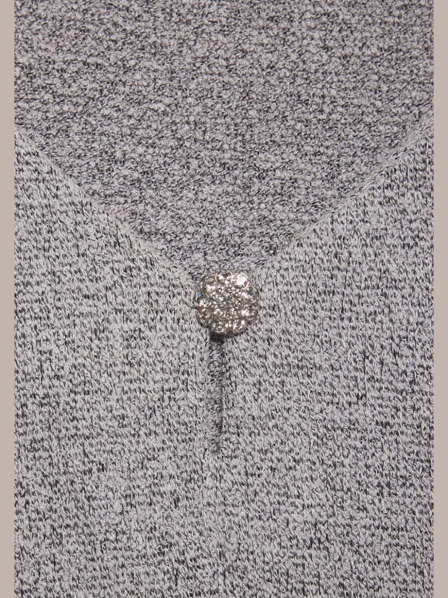 T-shirt à encolure V avec bouton brillant et strass