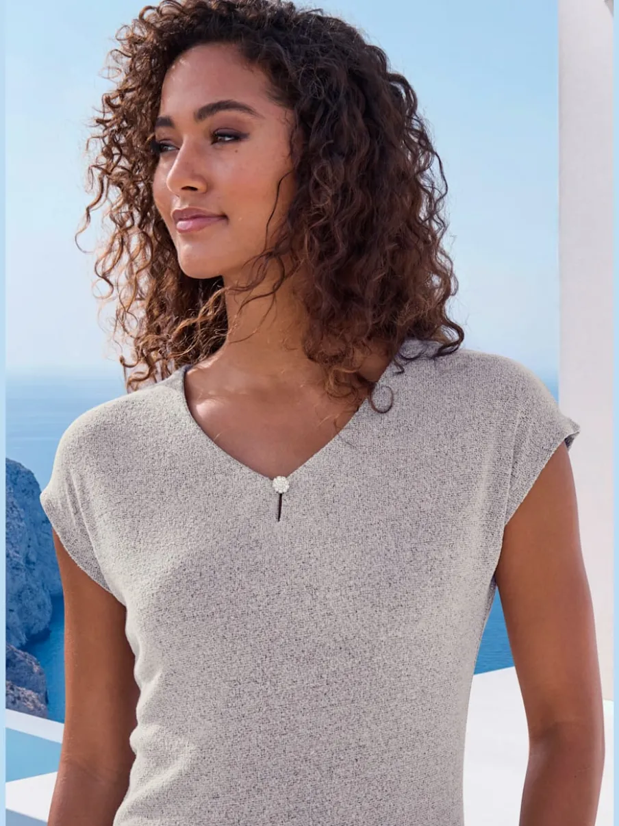 T-shirt à encolure V avec bouton brillant et strass