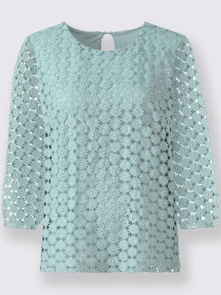 T-shirt en dentelle avec manches transparentes et fente