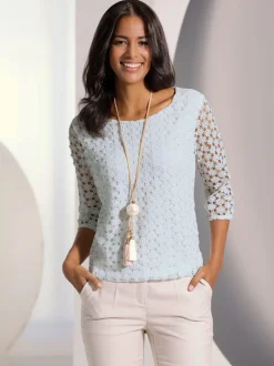 T-shirt en dentelle avec manches transparentes et fente