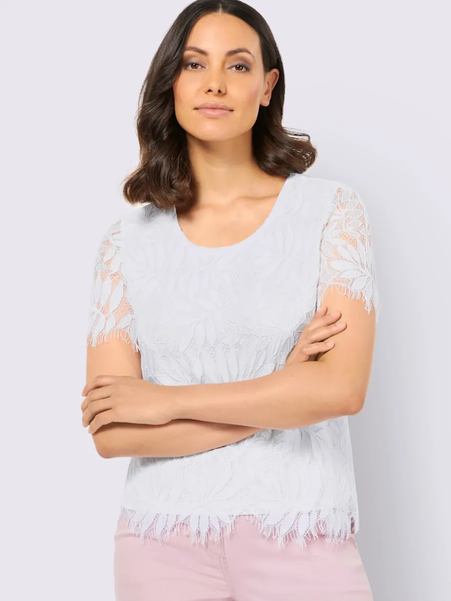 T-shirt en dentelle avec manches transparentes et finitions ondulées