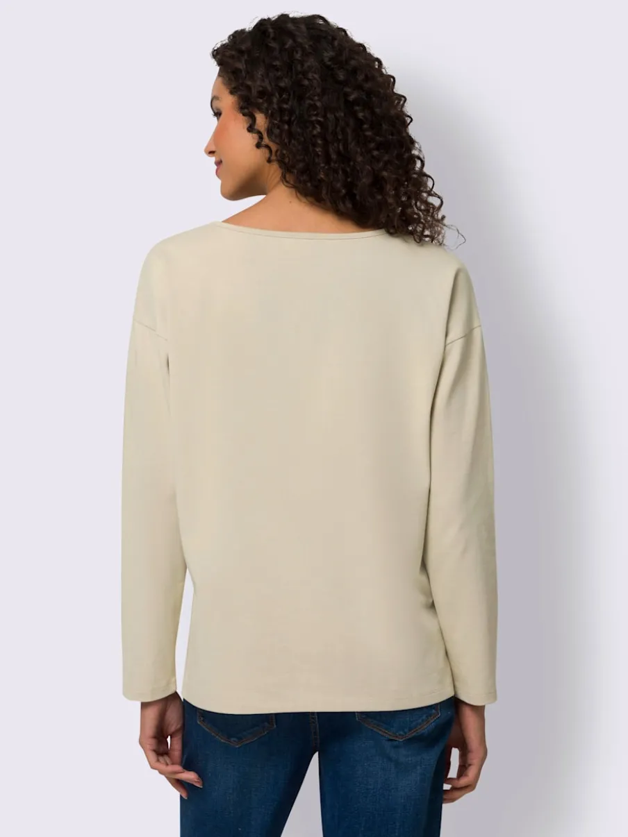 T-shirt en V avec dentelle délicate et manches longues