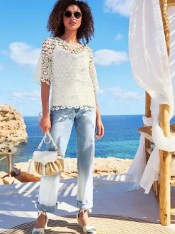 T-shirt léger en dentelle avec col rond et manches trompette