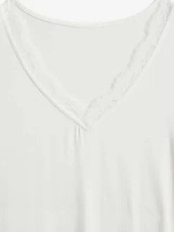T-shirt à manches courtes avec dentelle délicate à l'encolure en v