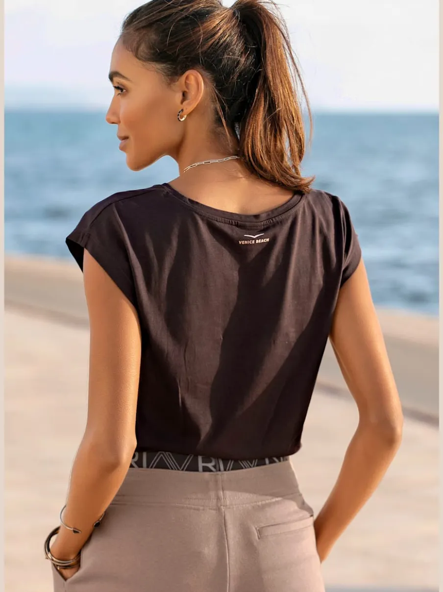 T-shirt à manches courtes avec encolure ronde et logo brillant