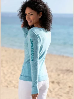 T-shirt à manches longues avec coutures contrastées et imprimé sportif