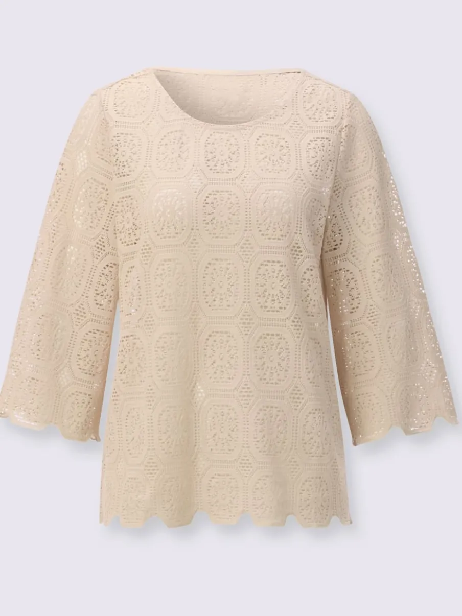 Tunique en dentelle avec encolure ronde et manches trompettes