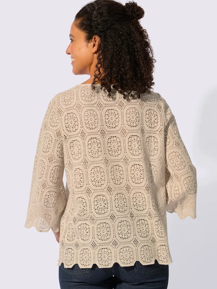 Tunique en dentelle avec encolure ronde et manches trompettes