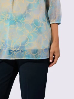 Tuniques à encolure en V avec motifs fleuris et volants