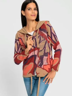 Veste à capuche en tricot avec inscription et pierres.