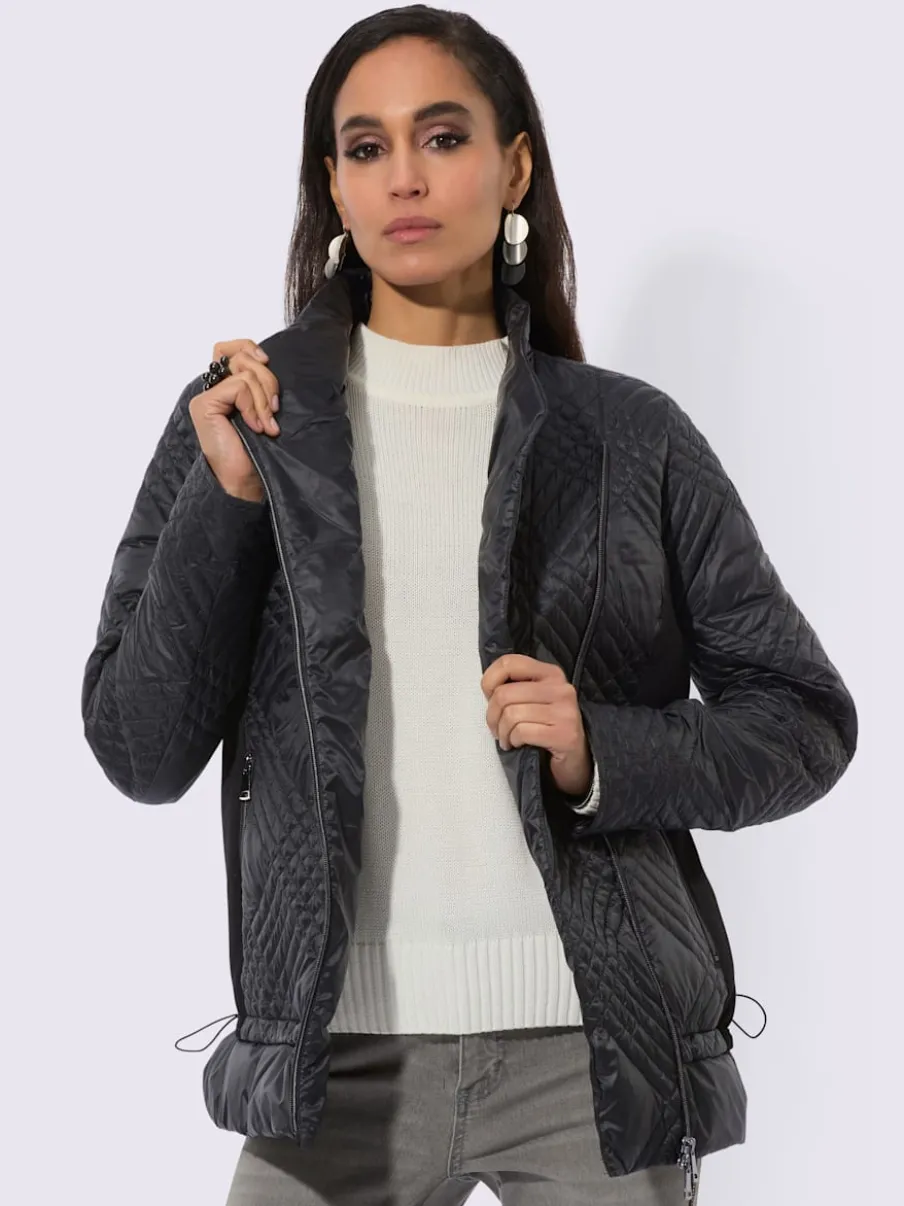 Veste en duvet avec col transformable et poches zippées