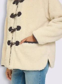 Veste en peluche passepoil contrasté